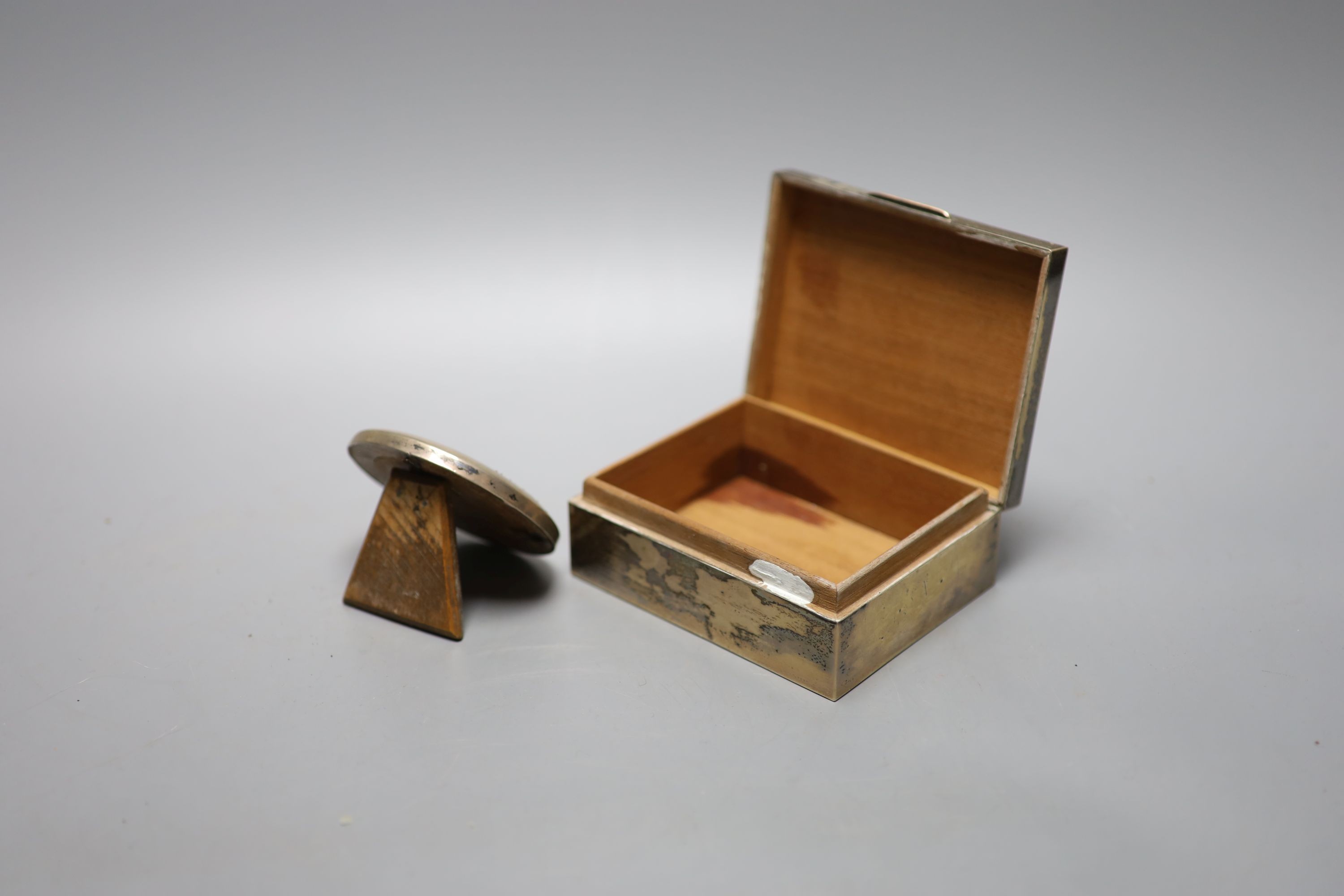 A modern part engine turned silver mounted cigarette box, Birmingham, 1962, 11.1cm and a small silver circular photograph frame.